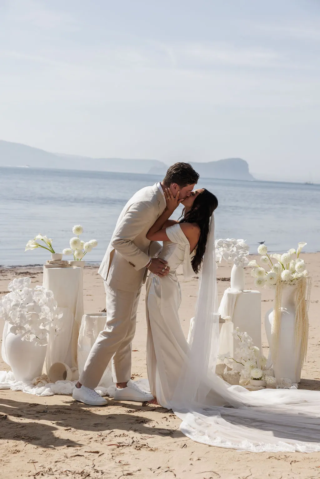 Couple embracing outdoors on their wedding day